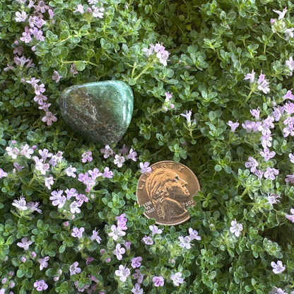 Green aventurine tumbled stone - detailed view showing natural inclusions and polished texture