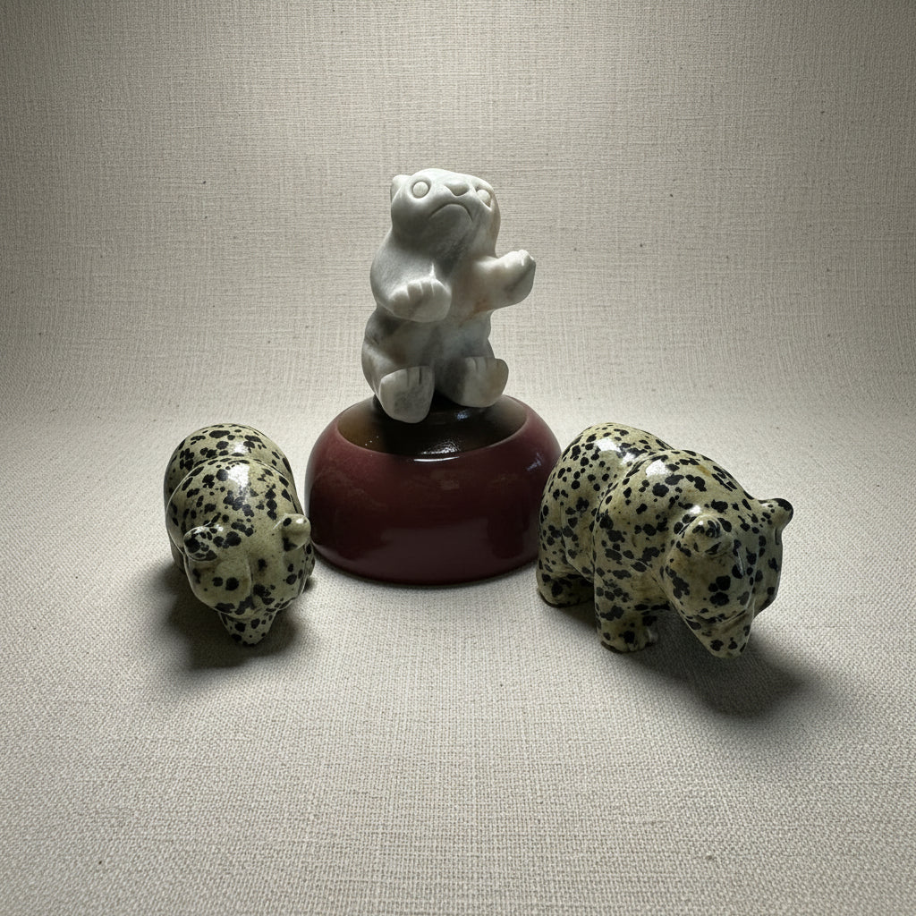 Three Gemstone Carved Bears on a white background