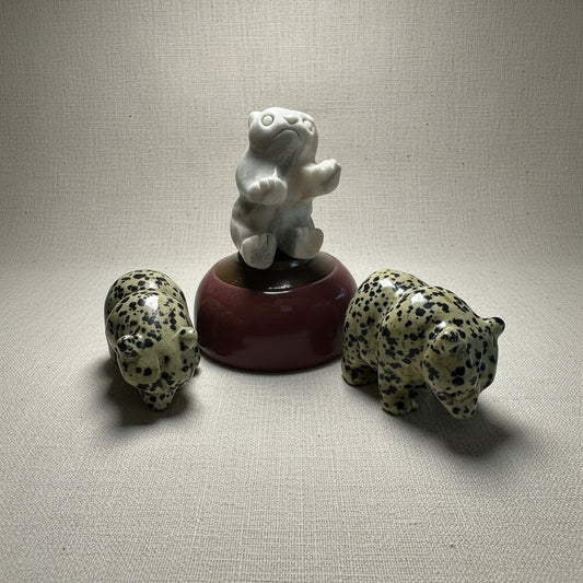 Three Gemstone Carved Bears on a white background